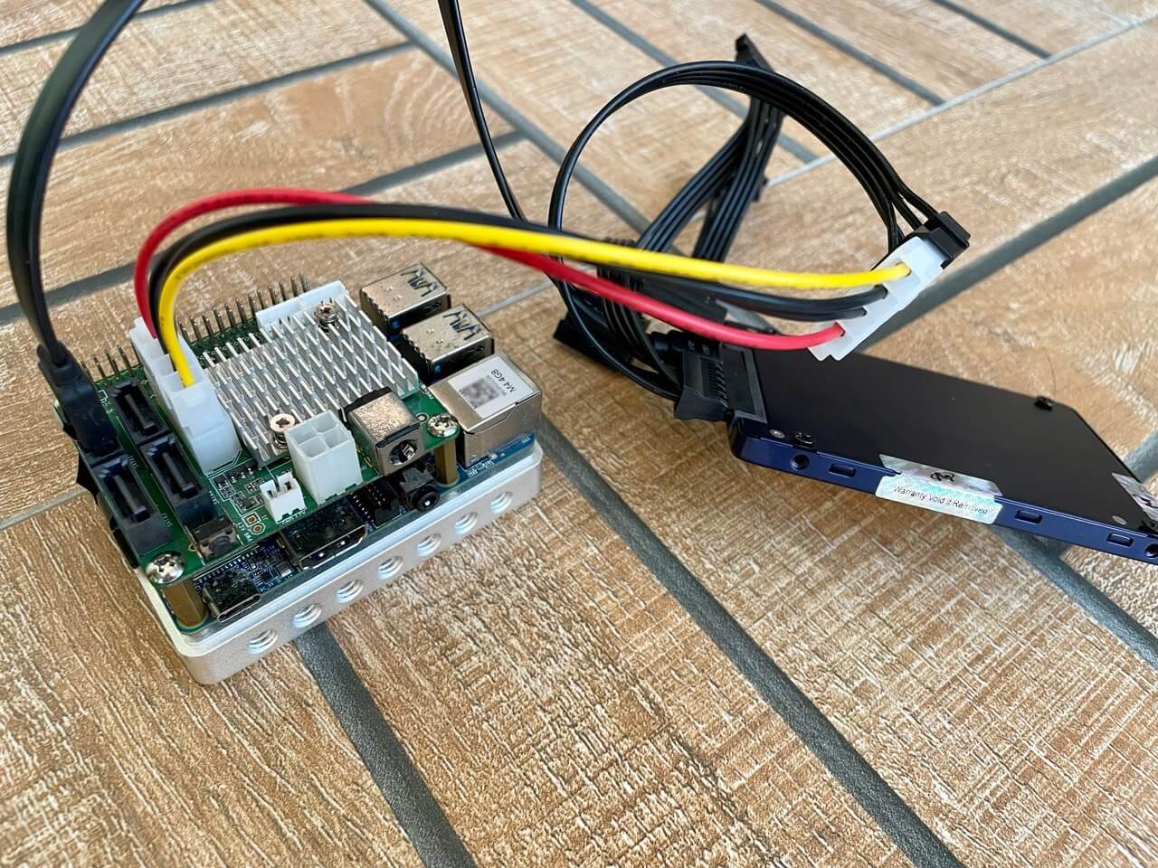 Development board and SATA HAT on the right, test hard drive on the left